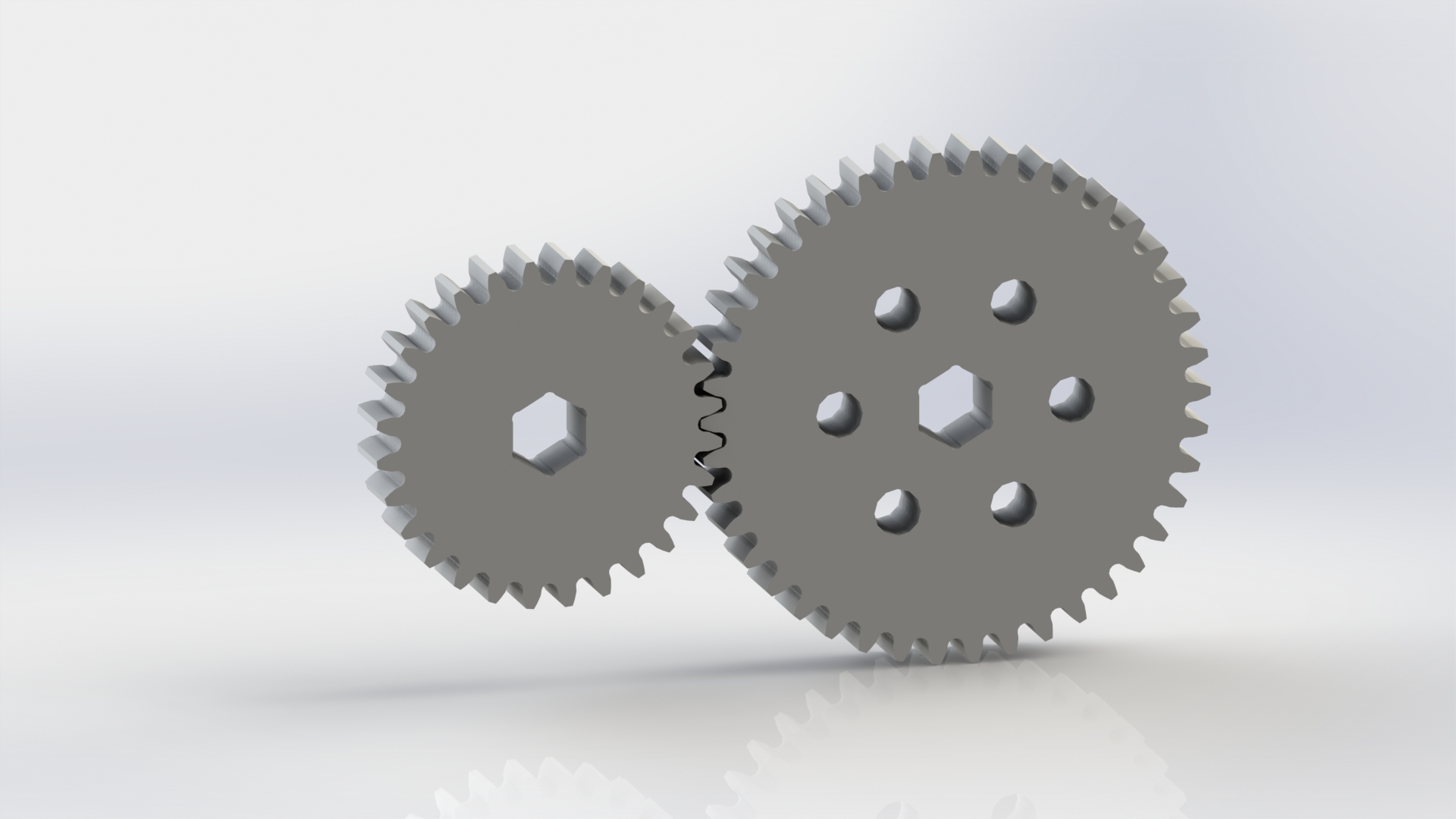 2 correctly meshed gears floating midair in a render